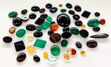 lot of 100 Carats of assorted loose gemstones varied size and shape Cabochon