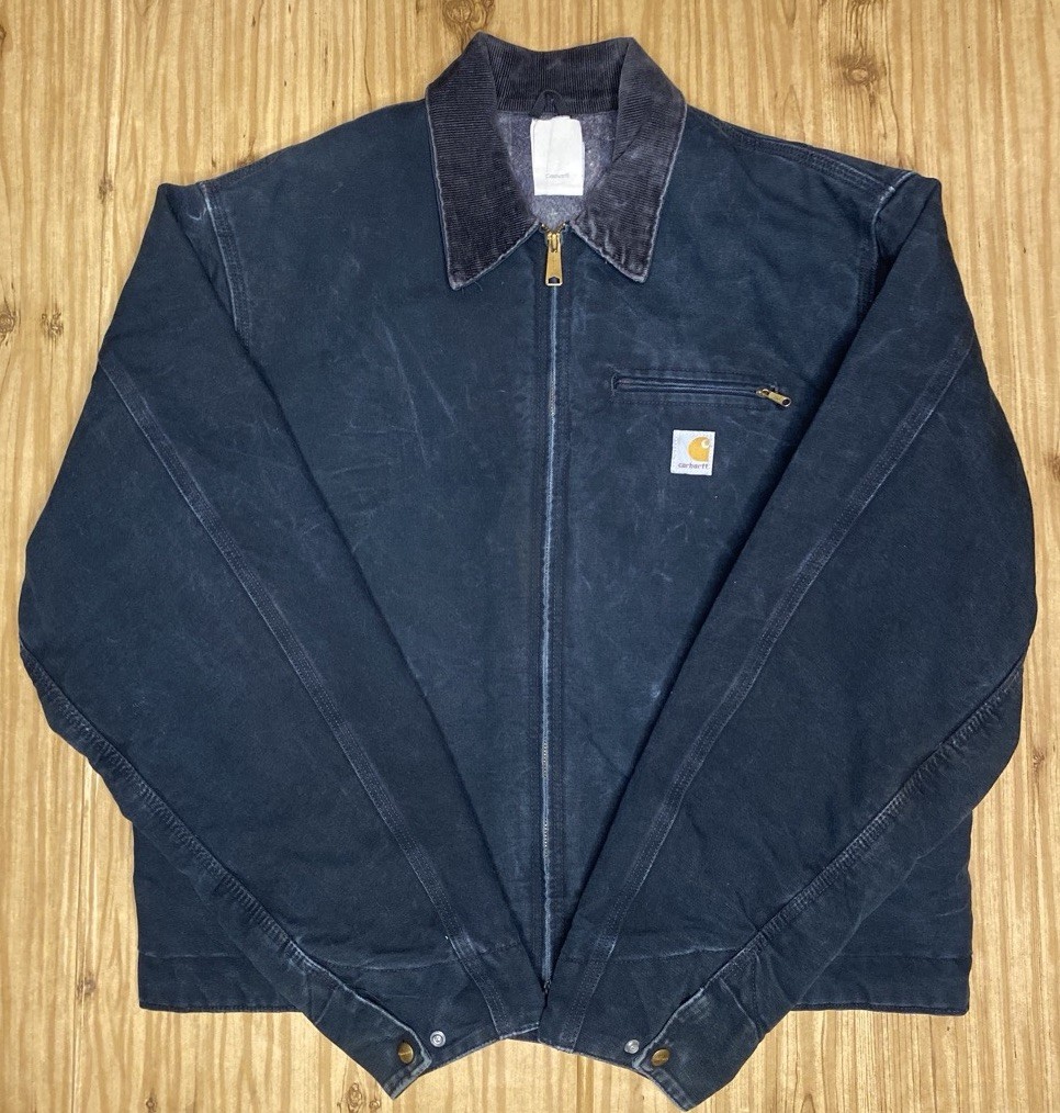 Black VTG Carhartt J01 BLK Detroit jacket size 46 with front zipper, collar, and white Carhartt logo patch on chest.