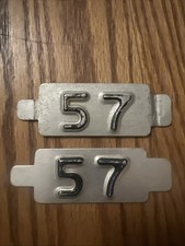 Pair Of 1957 Iowa License Plate Tabs