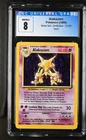 CGC 8 Base Set Alakazam Pokemon Card 1/102 Holo Rare 1999  - Blue Label