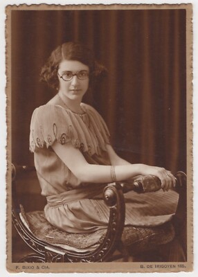 PRETTY WOMAN SITTING ON UNUSUAL CHAIR : BIXIO : BUENOS AIRES : ARGENTINA : RPPC