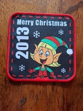 Christmas-themed embroidered patch featuring a holiday elf character