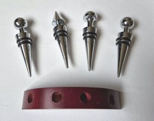 Stainless Steel Four Piece Decorative Wine Stopper Set, includes wooden stand