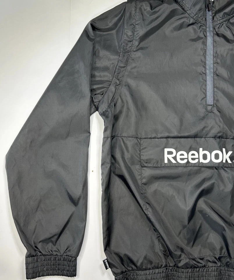 Chaqueta cortavientos Reebok niños 2XL Pullover 1/4 cremallera convertible chaleco para correr usado en excelente estado Foto 4 de 4