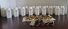 17 Vtg. Griffiths Spice Jars Milk Glass w/ Yellow Lids Black Painted Labels