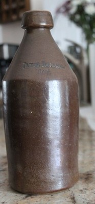 Antq. Stoneware Bottle w/Mystery Embossed Name   Heavy 10  ''Root'' Bottle