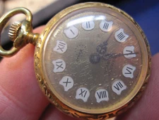 ladies Arnex gold color wind up pendant pocket watch ticking