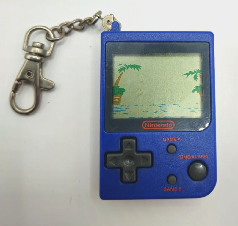1998 NINTENDO MINI CLASSICA PARACHUTE KEYCHAIN LCD HANDHELD GAME BLUE
