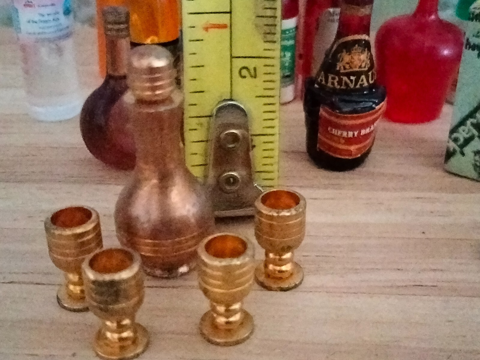 Dolls house pub items, brass door handles, bottles, glasses, tankards