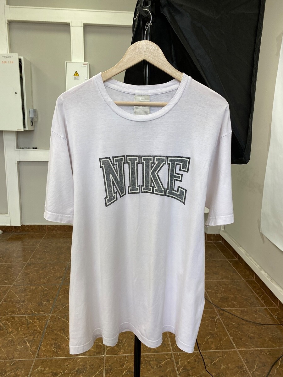 white nike shirt with silver swoosh