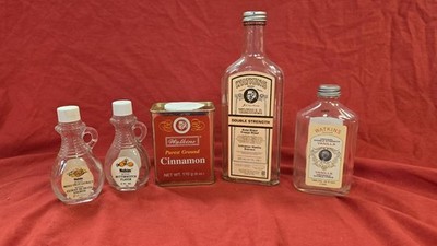 Lot A: vintage Watkins items, Glass Vanilla bottles, Cinnamon tin, 2 oz. cruets
