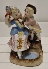 German Conta & Boehme Porcelain Match Striker Boy & Lady holding a Doll