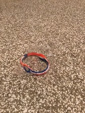 POWER BALANCE RED WHITE  BLUE RUBBER BRACELET BRAND NEW IN PACKAGE VERY NICE