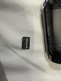 Sony PSP 1001 PlayStation Portable With Charger, new battery and 2 games.Works!!