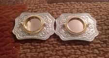 blank plated metal buckles with gold tone trim around buckles