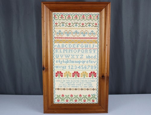 1970's embroidered cross stitch ABC Sampler, framed While on this glowing canvas