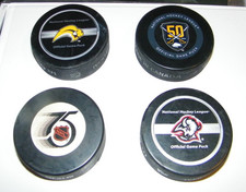 VINTAGE GAME USED BUFFALO SABRES HOCKEY PUCKS, LOT OF 4,ACQUIRED FROM OFFICIAL