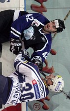 Barrett Jackman Primus Worldstars makes contact with Michal - Ice Hockey Photo