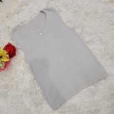 USED GREY SLEEVELESS KNIT TUNIC WITH CHANEL LOGO CHARM ACCEPTABLE