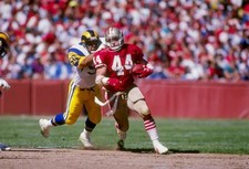 Fullback Tom Rathman San Francisco 49ers tries to break a tackle d- Old Photo