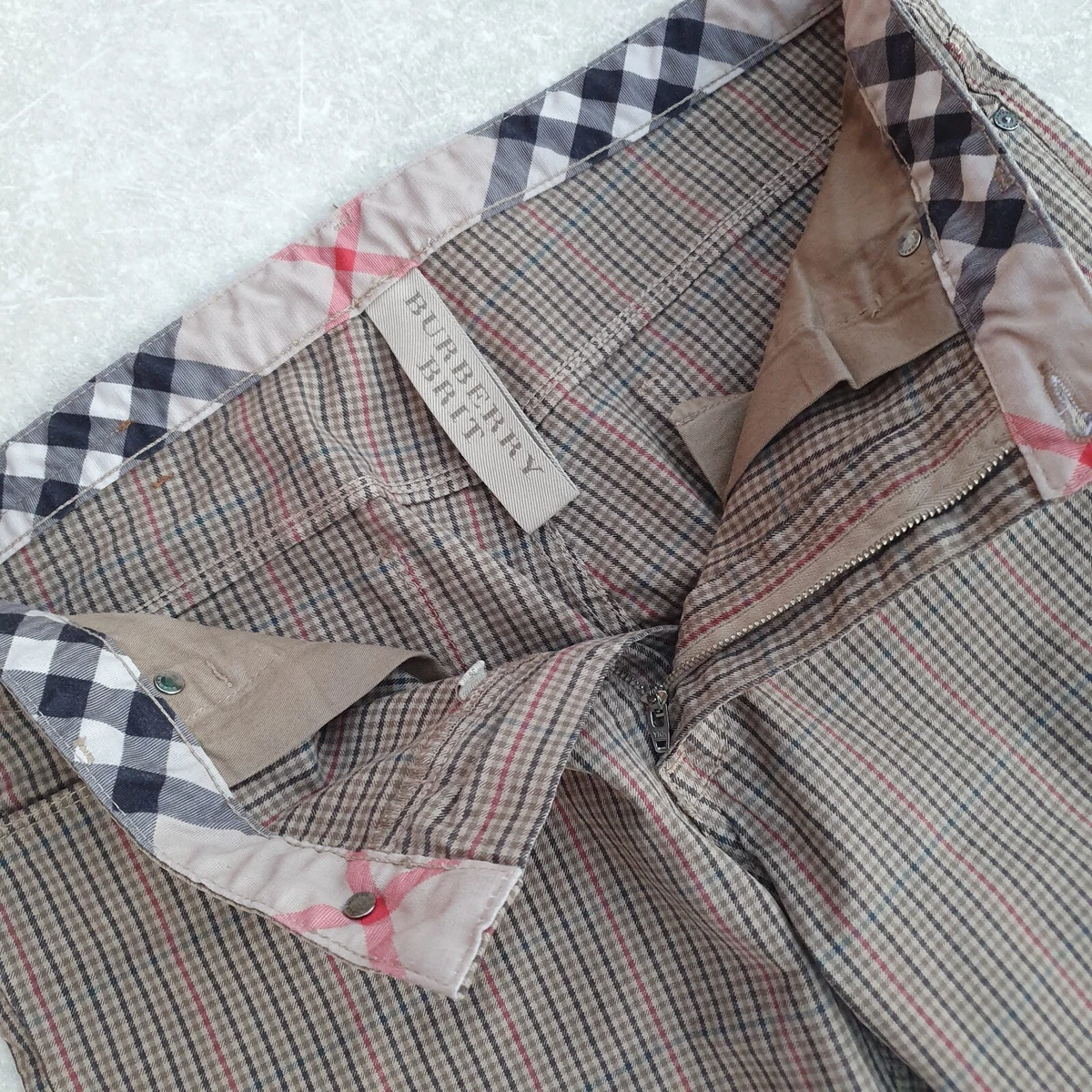 Nova check hotsell trousers fake