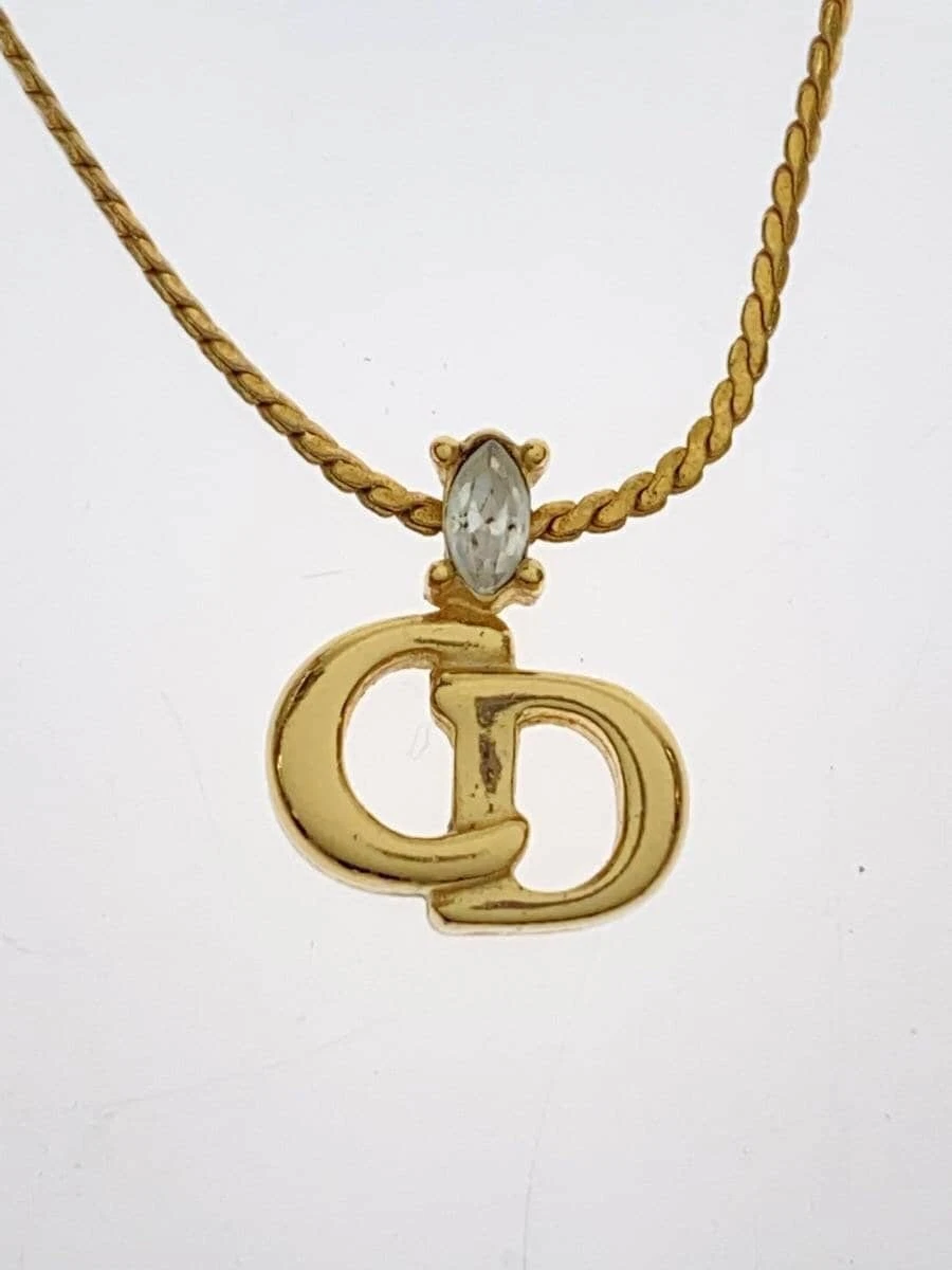 Collier Christian Dior    Femme avec haut doré