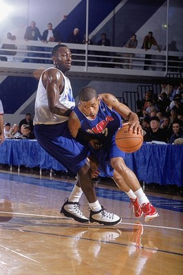 Lynn Greer drives past Mire Chatman at the NBA Pre-Draft Camp at - 2002 Photo
