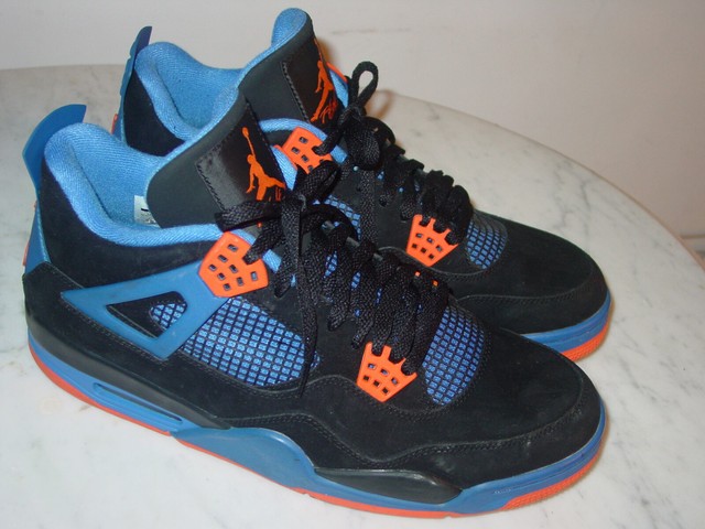 black and orange jordan 4