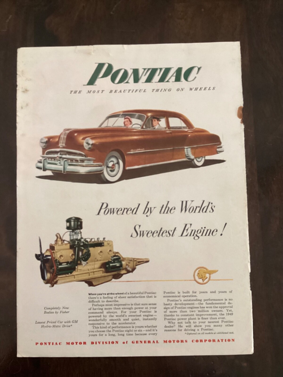 1949 Pontiac brown four door sedan Ad