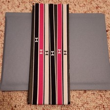 Under Armour headband set of 6 black, white, and pink. Never Used