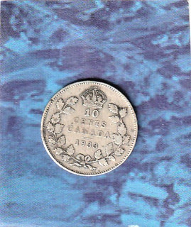 A silver Canada 10 Cent dime dated 1933