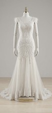 Stunning Mermaid Wedding Dress with Intricate Beading  Feather Accents