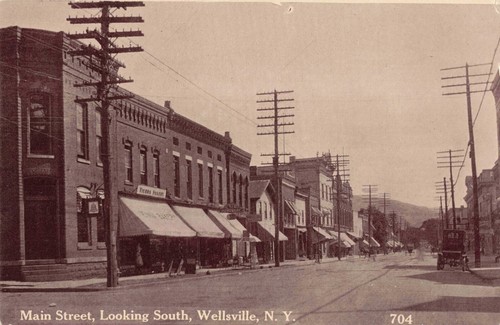 Main Street Looking South Wellsville New York NY Hardware Store c1910 Postcard - 第 1/2 張圖片