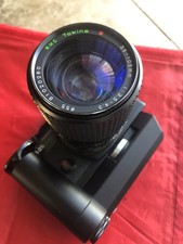 Olympus OM 2S Program Camera With A Close Focus Zoom Lens And Batteries