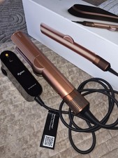 Dyson Airstrait Uses Powerful Directional Airflow to Smooth and Align Hair. 