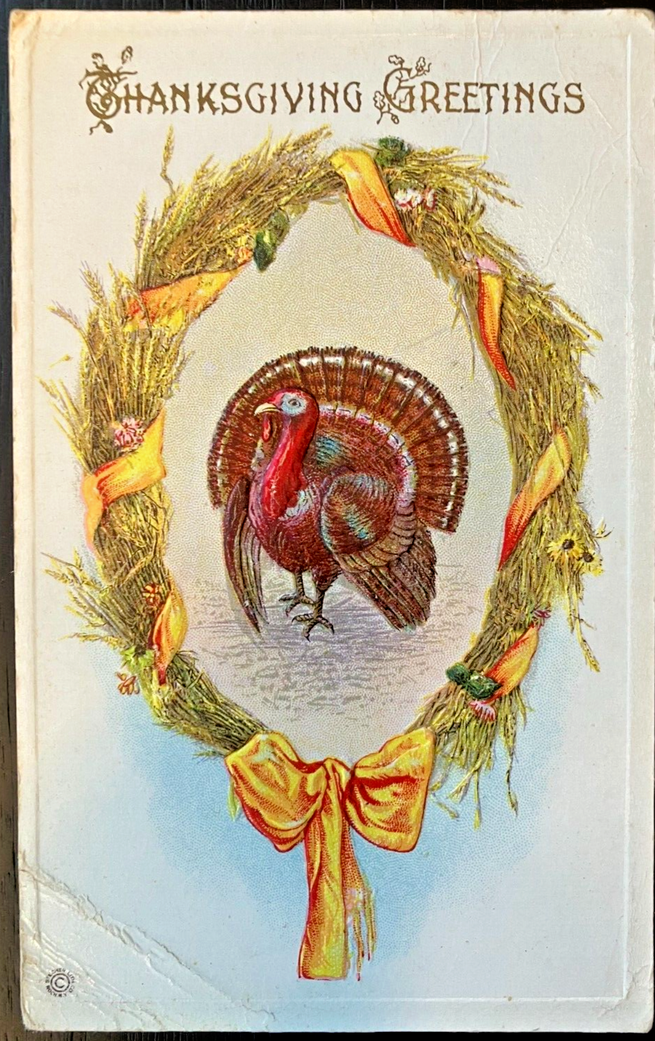 Antique Thanksgiving Greetings Postcard with Turkey in Hay Wreath and Gold Ribbon
