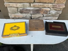 Lot of three wooden cigar boxes.