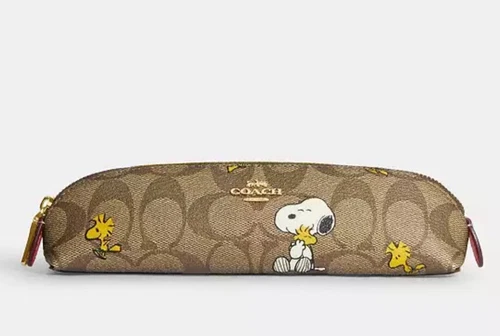 Astuccio portamatite Coach X Peanuts in tela firmato con Snoopy (nuovo con difetti).