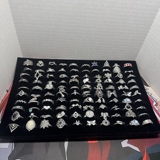 Lot Of 100 silver tone Rings sizes vary comes with tray included lot 1 m3