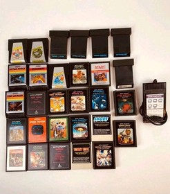 Atari 7800 console with 35 games, 2 controllers, power cord, storage case WORKS