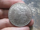 1896 O MORGAN SILVER DOLLAR IN ABOUT UNCIRCULATED CONDITION CLEANED