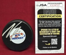 JSA CERTIFIED NOAH HANIFIN SIGNED TEAM USA HOCKEY PUCK - GOLD MEDAL WINNER