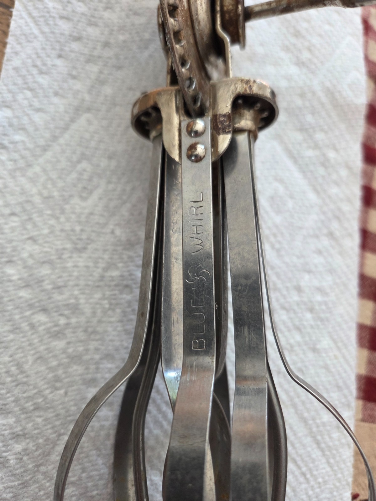 Vintage blue swirl stainless hand beater in good working condition