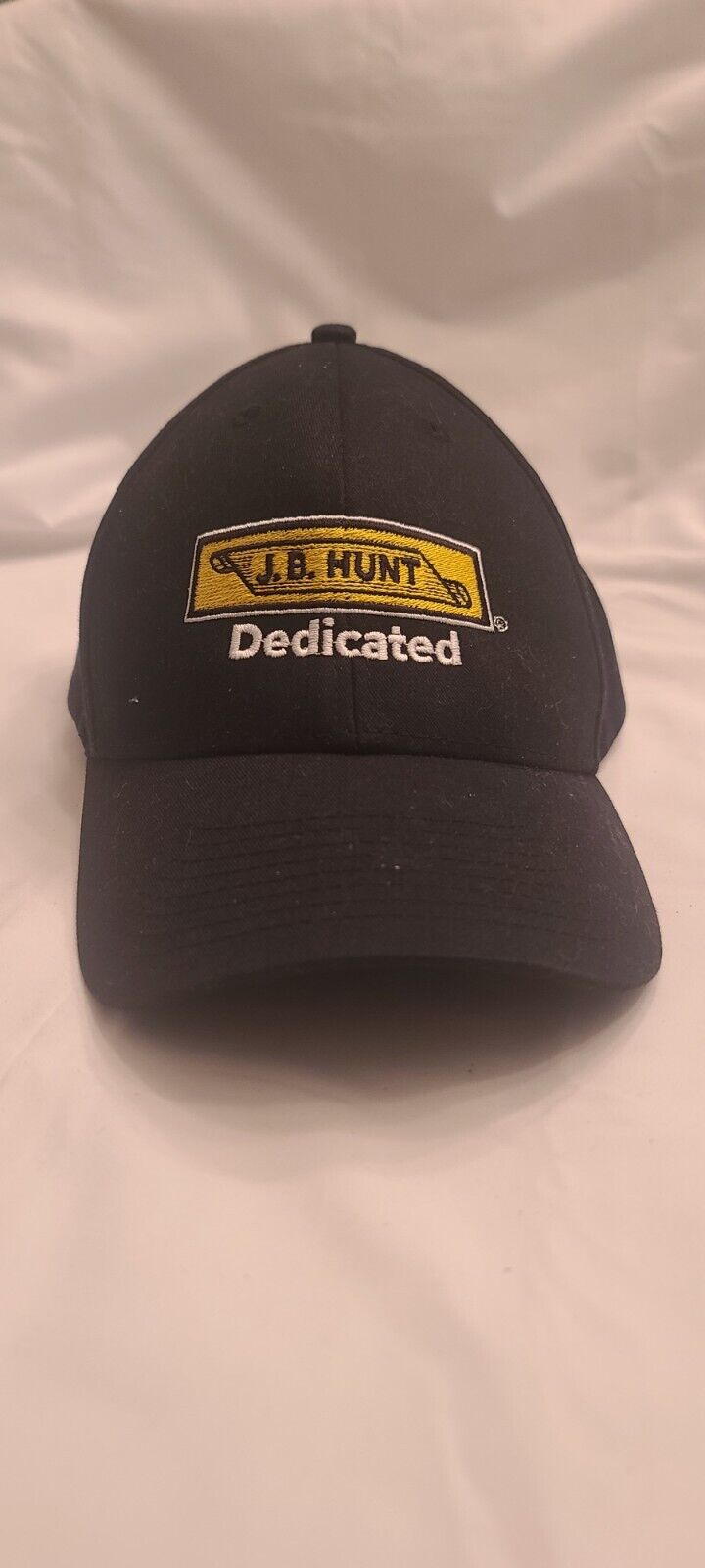 J.B. Hunt Dedicated Baseball Style Hat Black, Yellow, White. Cintas