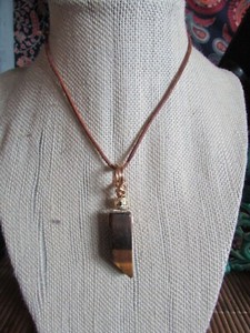 Authentic Wire wrapped Tiger eye Pendant. Gold plated wire, and gold colour accent.