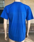 Royal blue short-sleeve shirt with white POW MIA Never Forgotten stamp and USA flag on back, worn on mannequin.