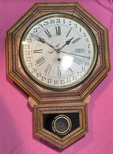 ANTIQUE WATERBURY CLOCK CO. SHORT DROP CALENDAR OAK SCHOOLHOUSE WALL CLOCK RUNS
