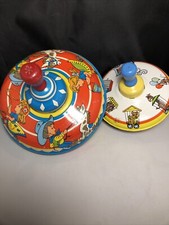 Two Vintage 1950s Ohio Art Tin Spinning Tops Cowboy Cowgirl and Circus Train