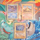 Pokemon TCG 1st Edition Rocket Squirtle, Blaine's Charmander, Machamp.