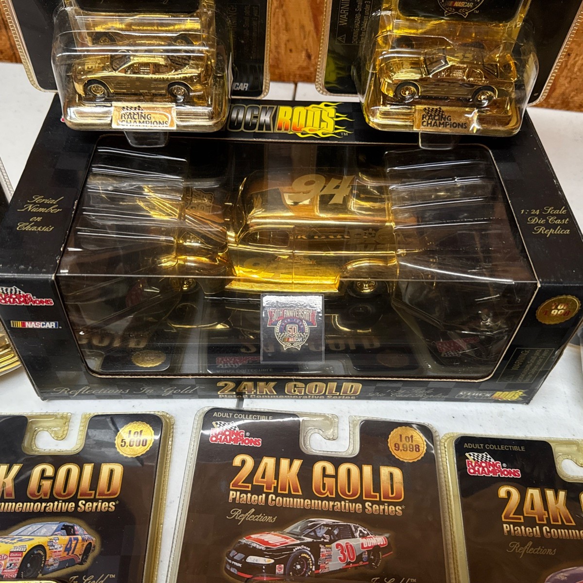 Lot Of 7 Racing Champions 24k Gold Cars 1:64 & 1 Gold plated Car 1